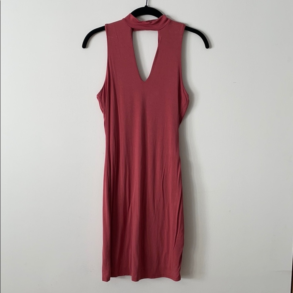 High neck, deep v, bodycon pink minidress.